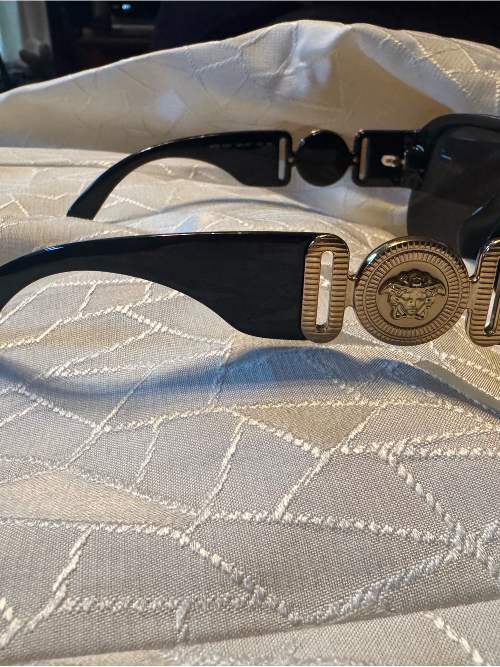 Black Sunglasses with Gold Medallion Accent versace